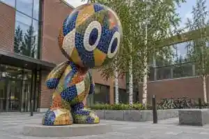 Detail of the recessed grout lines between mosaic tesserae on a cartoon abstract character