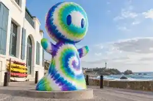Detail of the raw colour bleed edges on a tie-dye cartoon abstract character sculpture