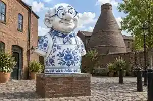 Porcelain style cartoon bust of a master potter in the garden of a Stoke-on-Trent pottery museum