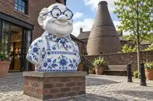 Detail of the hand-painted cobalt border bands on a porcelain style cartoon bust