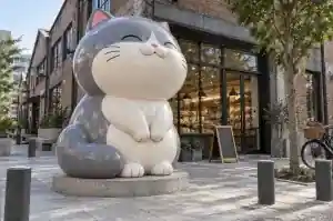 Three-quarter view of a 1.9 m plump cartoon cat sculpture with fat rounded seams