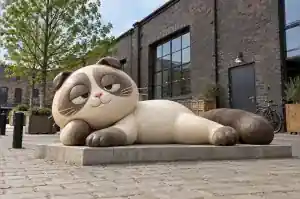 Detail of the hand-pressed clay texture on the head of a cartoon ragdoll cat sculpture