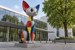 Bauhaus colour block cartoon sphynx cat sculpture in fibreglass outside a Dessau museum