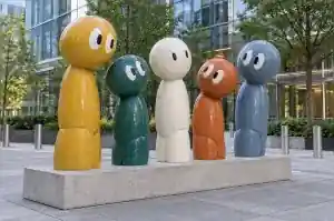 Three-quarter view of five simplified cartoon character forms leaning at different angles