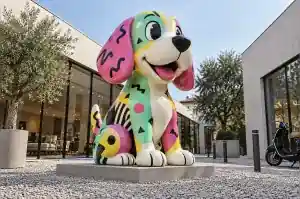 Memphis style cartoon beagle sculpture in a Milan design district showroom courtyard