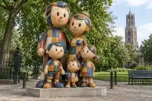 Detail of the stitched seam lines between patches on a patchwork cartoon family sculpture