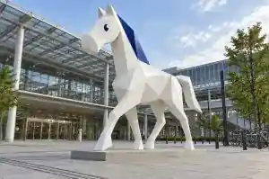 Origami cartoon horse sculpture in fibreglass on a Kyoto station plaza