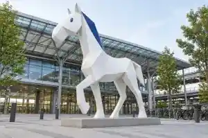 Detail of the sharp creases and folded planes on an origami cartoon horse sculpture