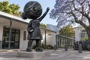 Chalkboard finished cartoon teacher sculpture at a Cape Town school forecourt