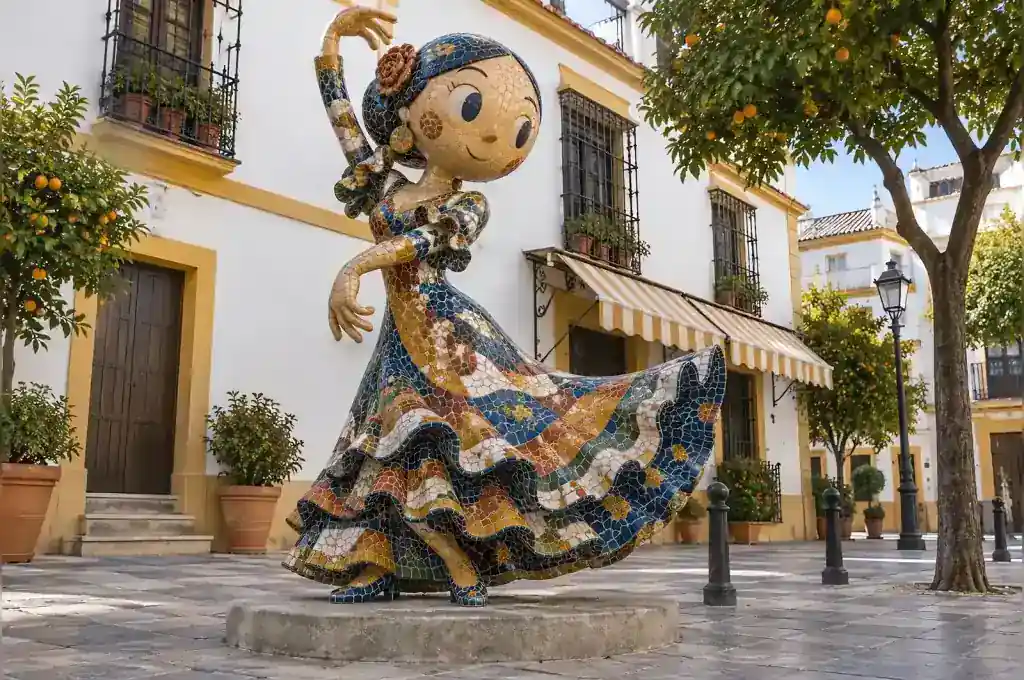 Mosaic cartoon flamenco dancer sculpture in a Seville plaza with hand-cut tesserae