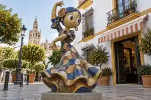 Detail of the recessed grout lines between mosaic tesserae on a cartoon dancer sculpture